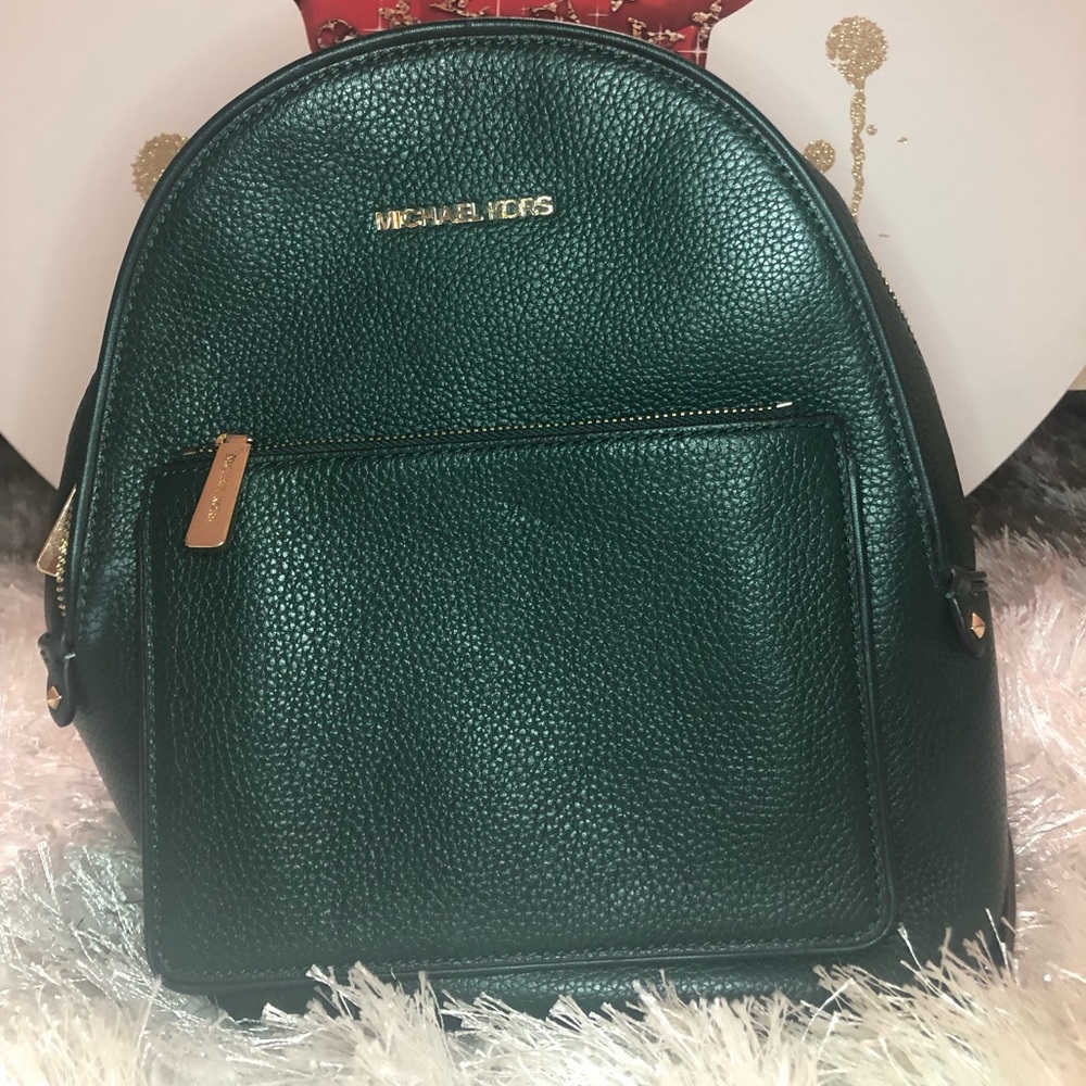 Green Michael Kors mini backpack